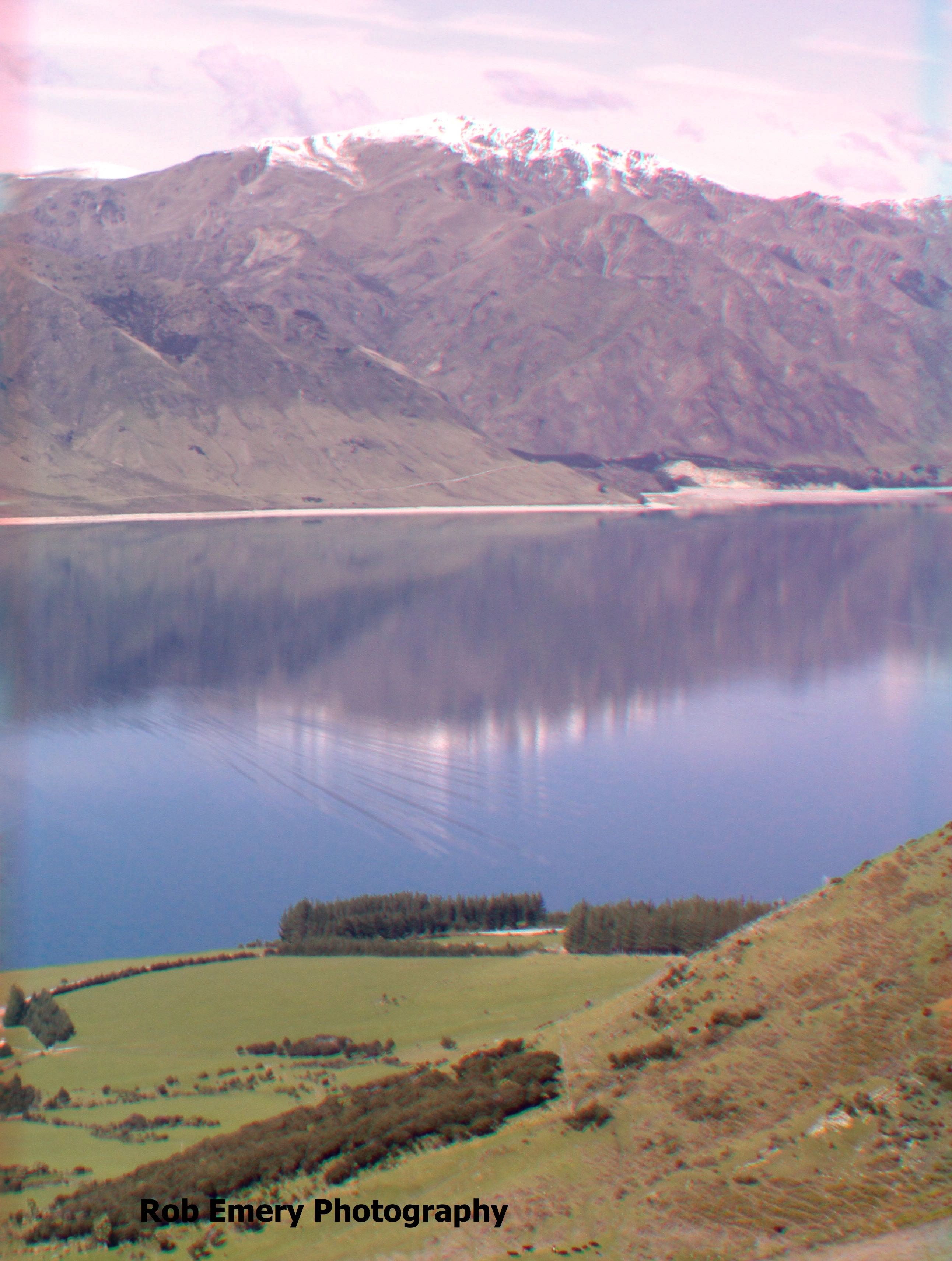 view of mountains and mirror flat lake